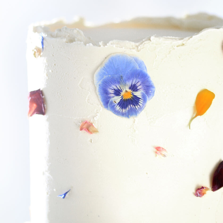 closeup_textured_buttercream_pressed_flowers_wedding_cake_fitzbillies.jpg__PID:ad335c9c-a12e-4f92-9022-b91d16137b6e