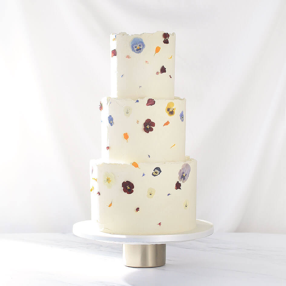 hero_textured_buttercream_pressed_flowers_wedding_cake_fitzbillies.jpg__PID:8af467e0-b9ce-4d33-9c9c-a12edf921022